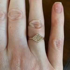Gold ring in diamond shade with gems inside